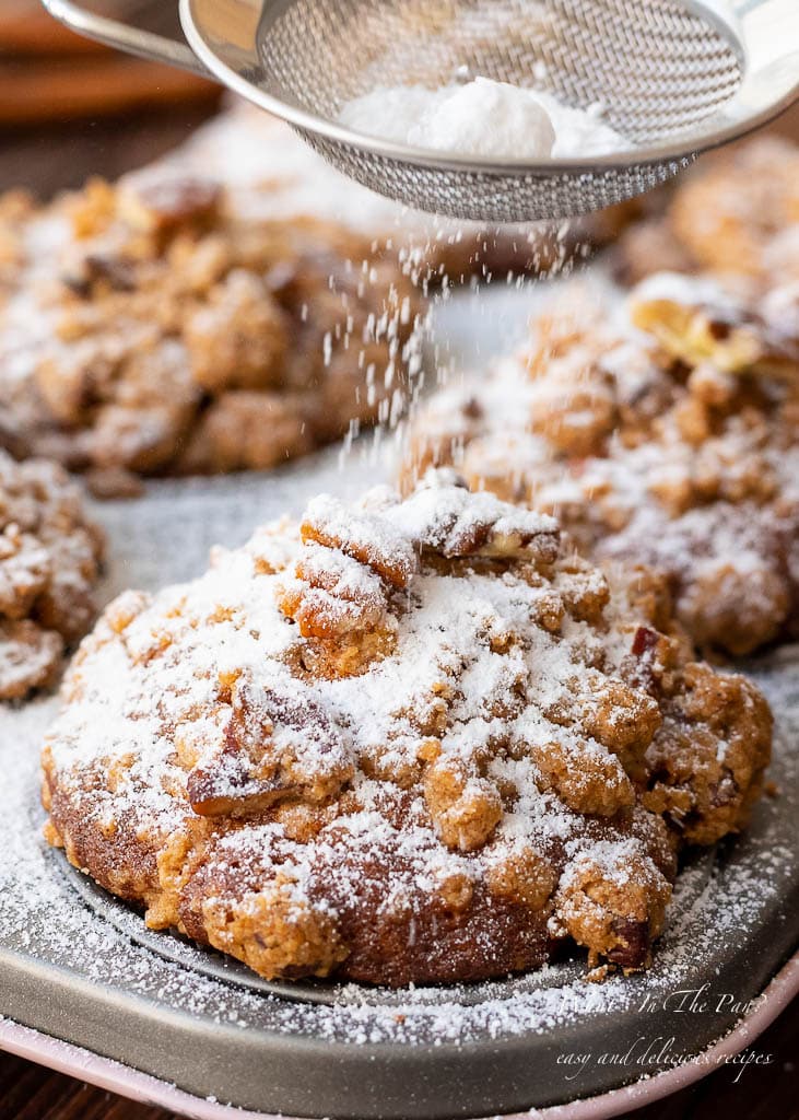 Pumpkin pecan muffins with confectionary sugar