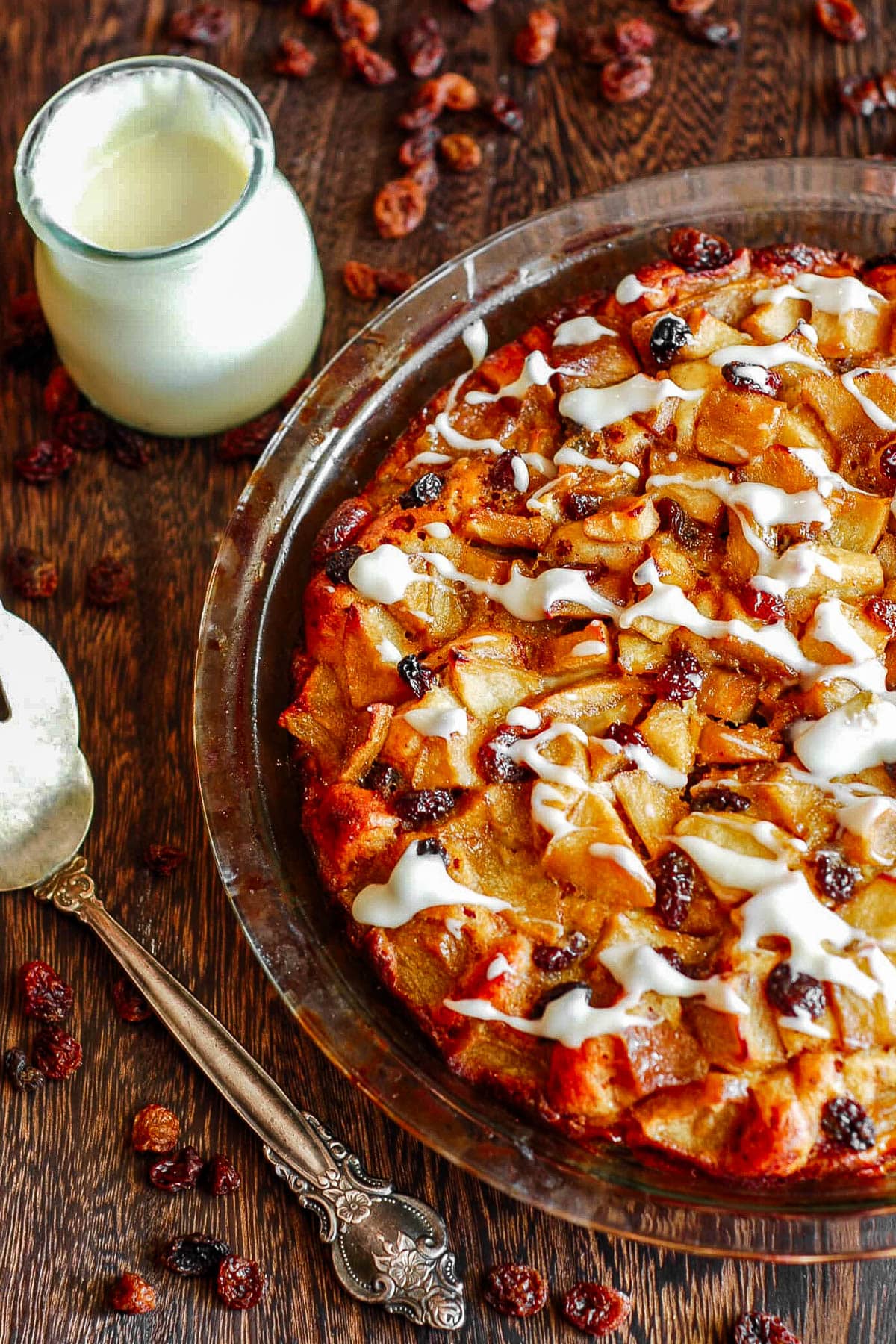 apple cinnamon roll cake with cream cheese frosting on top