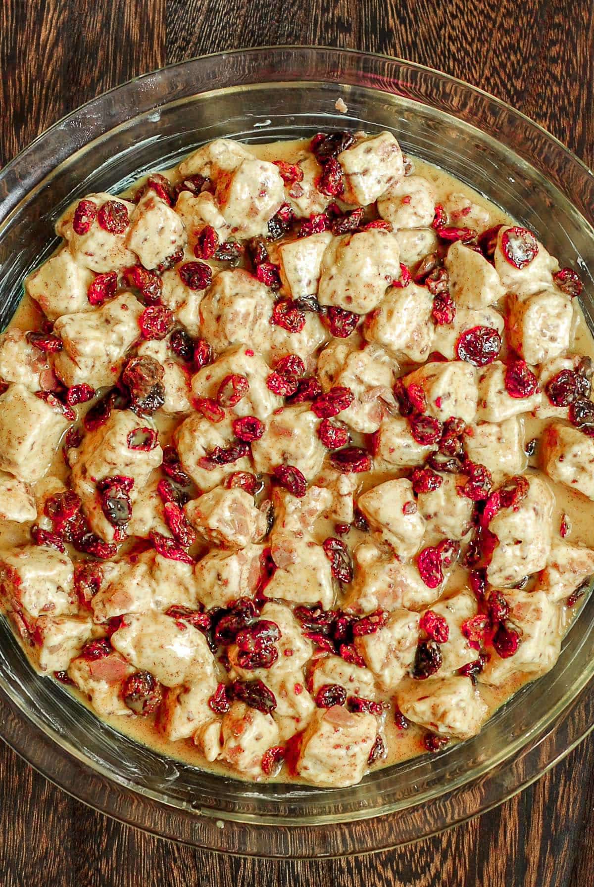 cranberries on top of apple cinnamon roll cake