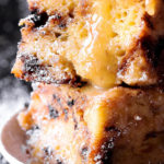 Chocolate Chip Panettone Bread Pudding in Bourbon Butter Sauce in small white plate
