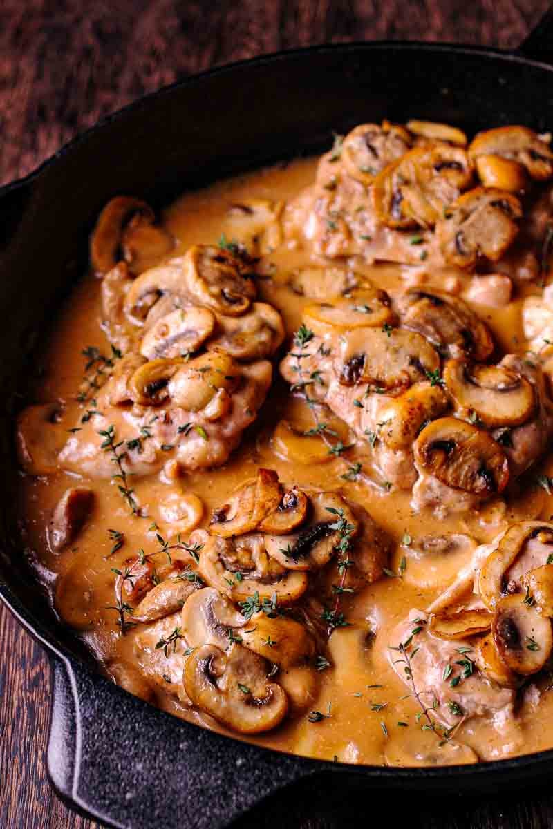 Skillet Chicken Thighs in Creamy Mushroom Pan Sauce chicken thighs in mushroom sauce with wine