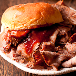 Slowk Cooker Beef Brisket in a bun with BBQ sauce
