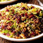 Warm Quinoa and Brussels Sprout Salad with Cranberries and Pecans