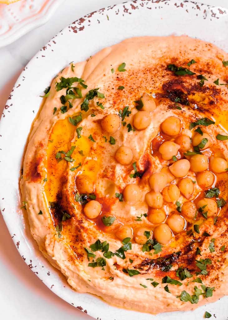 Smooth Hummus with Roasted Garlic with Chickpeas on a plate