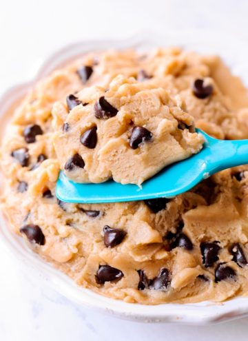 Edible Chocolate Chip Cookie Dough on white play and scooped in teal spoon