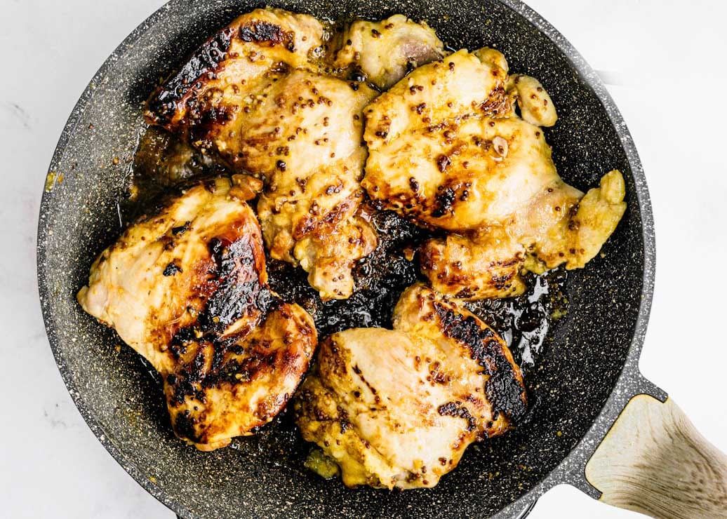 Chicken thighs in a cooking pan