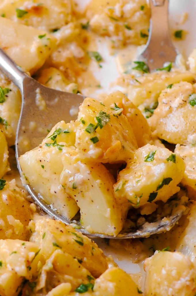 Creamy Garlic Potatoes on a spoon