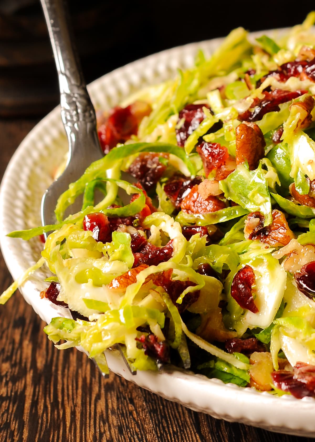 Brussels Sprouts Salad with Pecans and Dried Cranberries on a plate