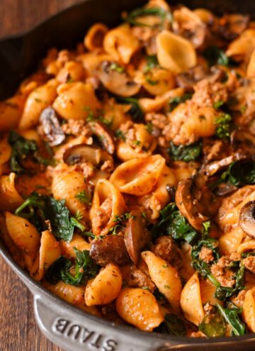 Beef and Shells with Spinach and Mushrooms in a pan