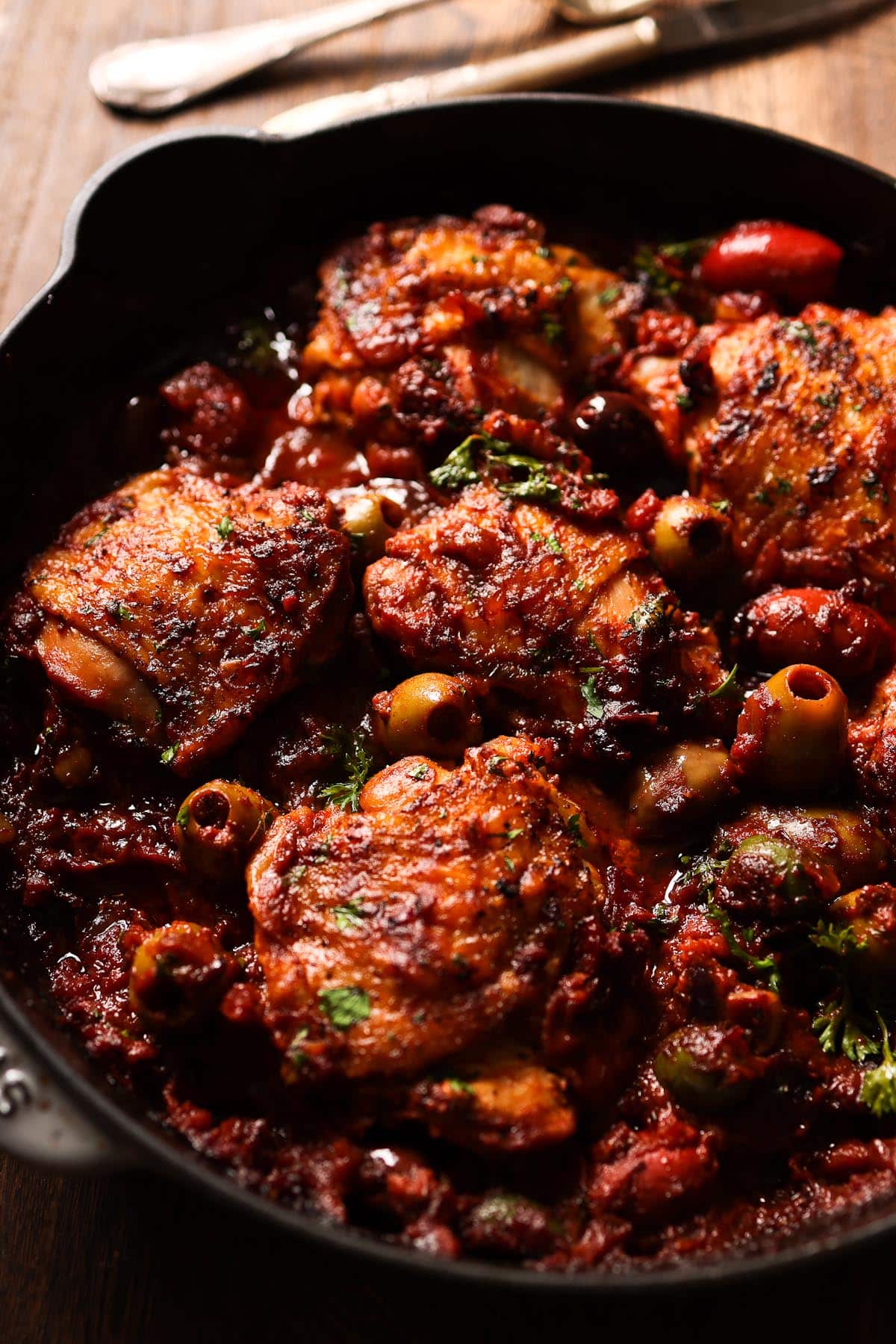 Italian braised chicken with olives in a skillet