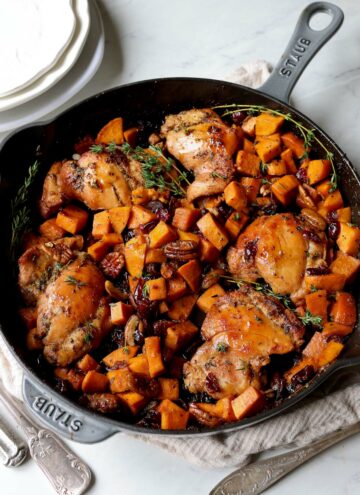 sweet potatoes and chicken in a cast iron pan