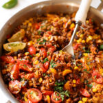 Mexican Beef and Rice skillet with tomatoes and cheese, corn and salsa