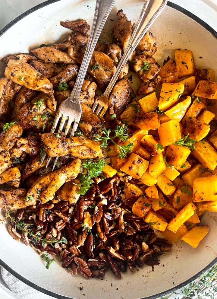 Chicken and sweet potatoes in a skillet