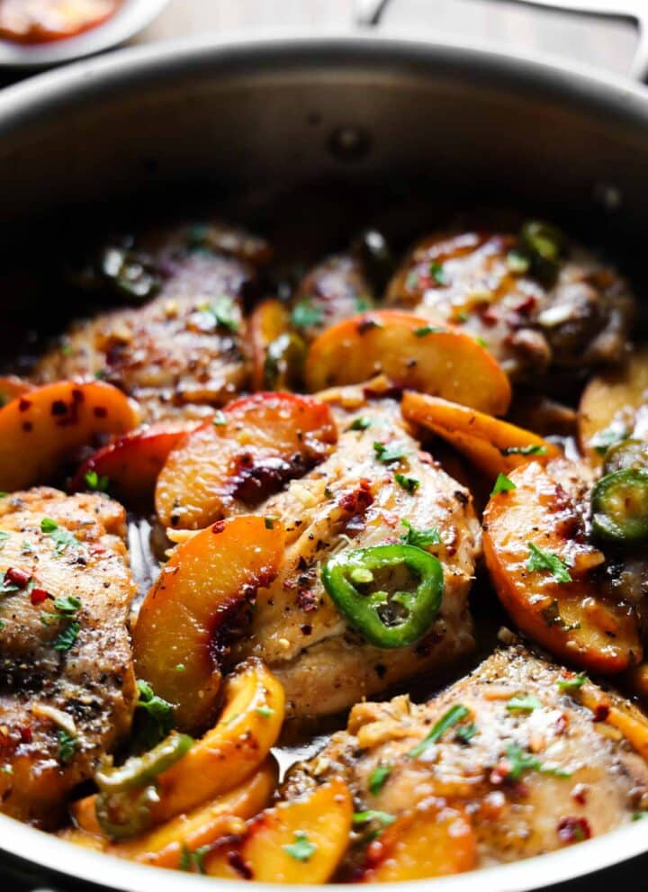 Peach and Jalapeño Chicken Thighs in a skillet