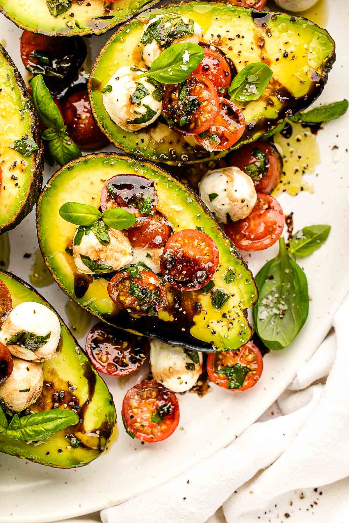 Caprese stuffed avocados with cherry tomatoes