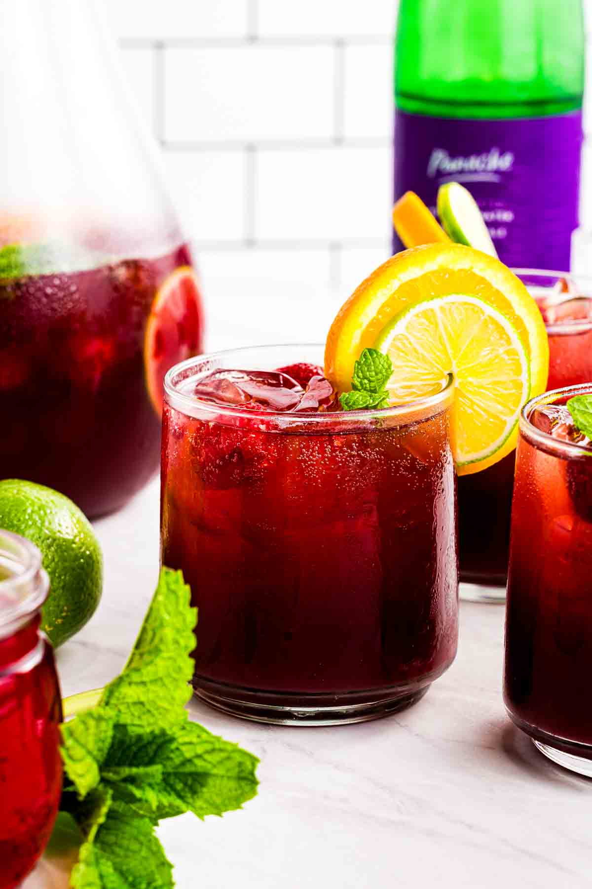 red sangria poured into glass with ice