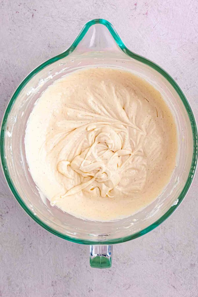 softened cream cheese with condensed milk in the bowl