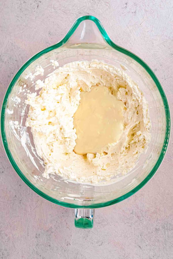 softened cream cheese with vanilla and whipping cream