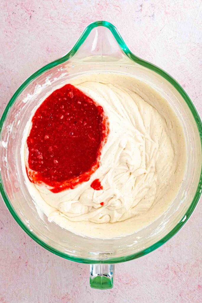 strawberry puree added into the bowl with cream cheese and condensed milk