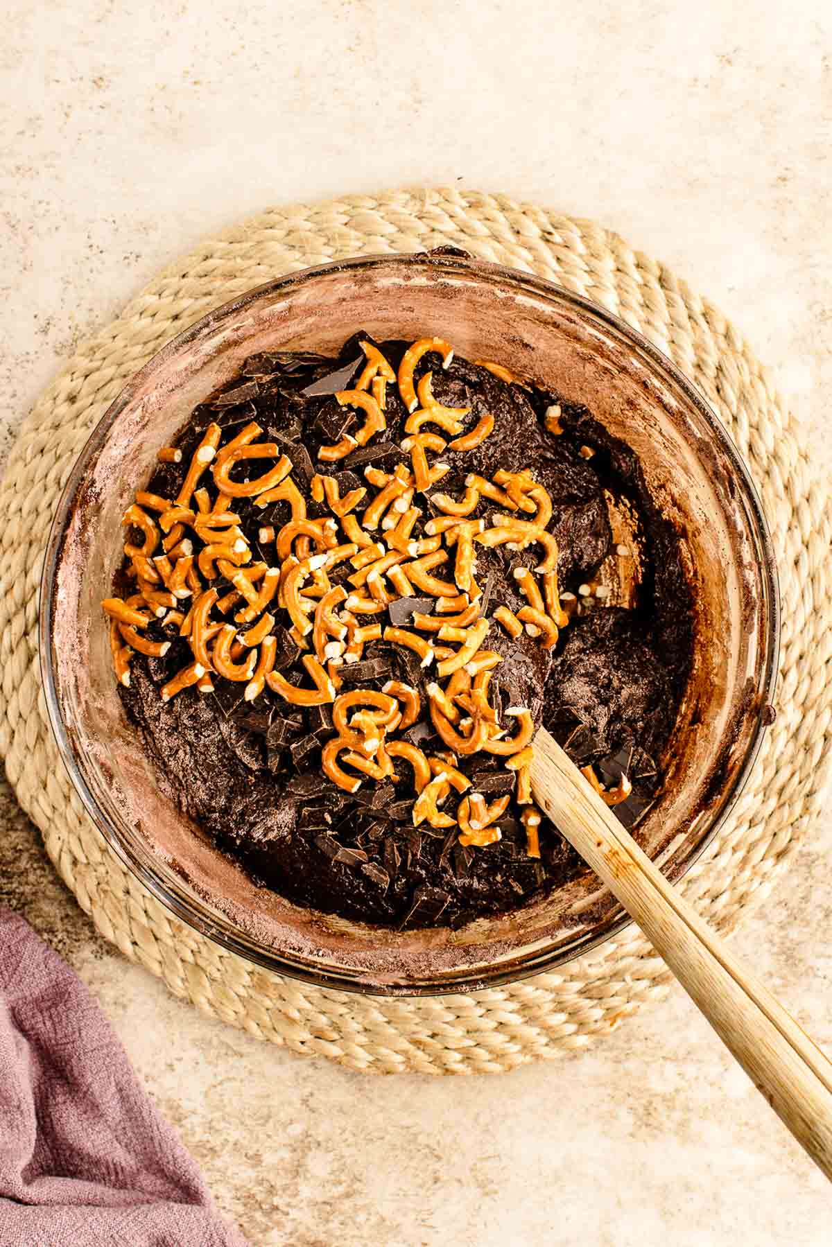 Crushed pretzels on top of brownie batter