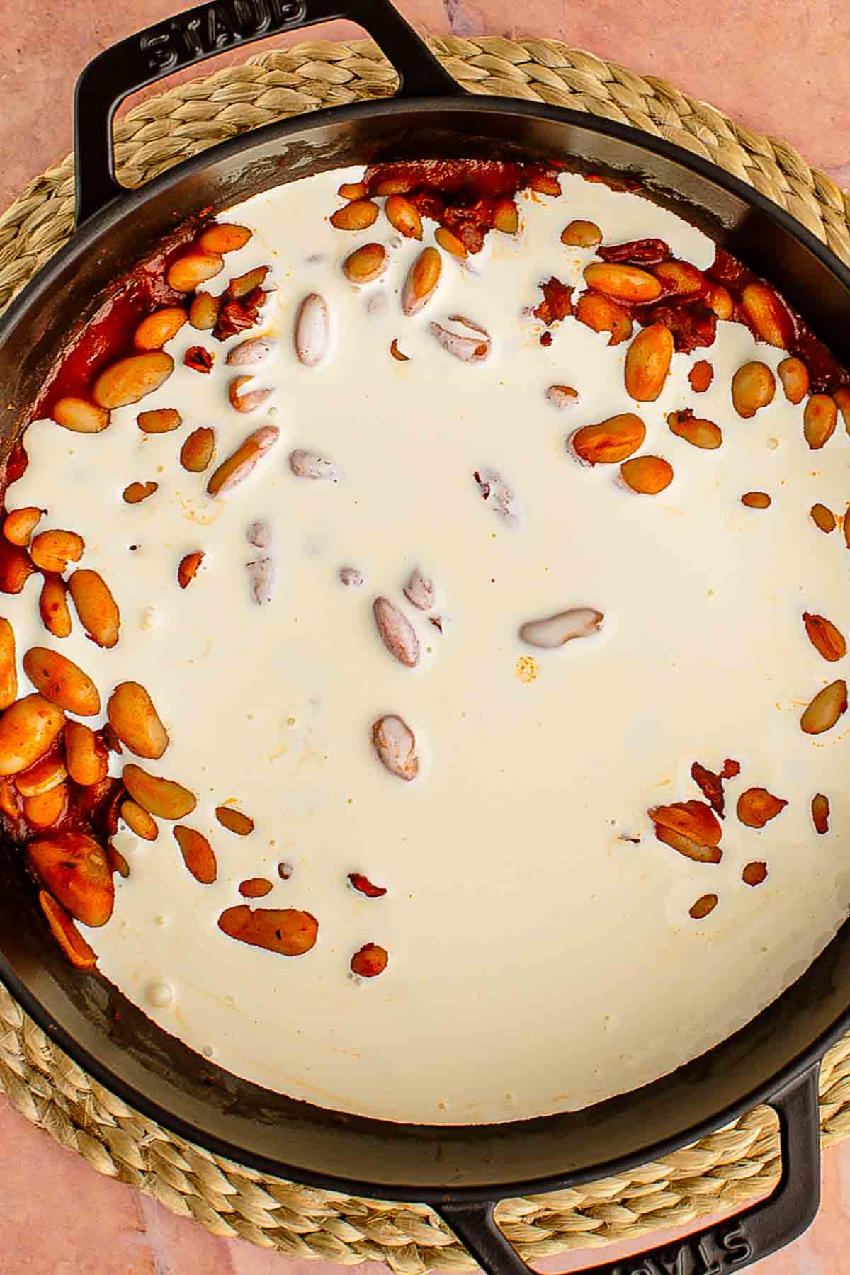 heavy cream poured over marry me butter beans tuscan style