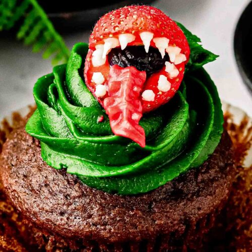 Top strawberry on Audrey II cupcakes