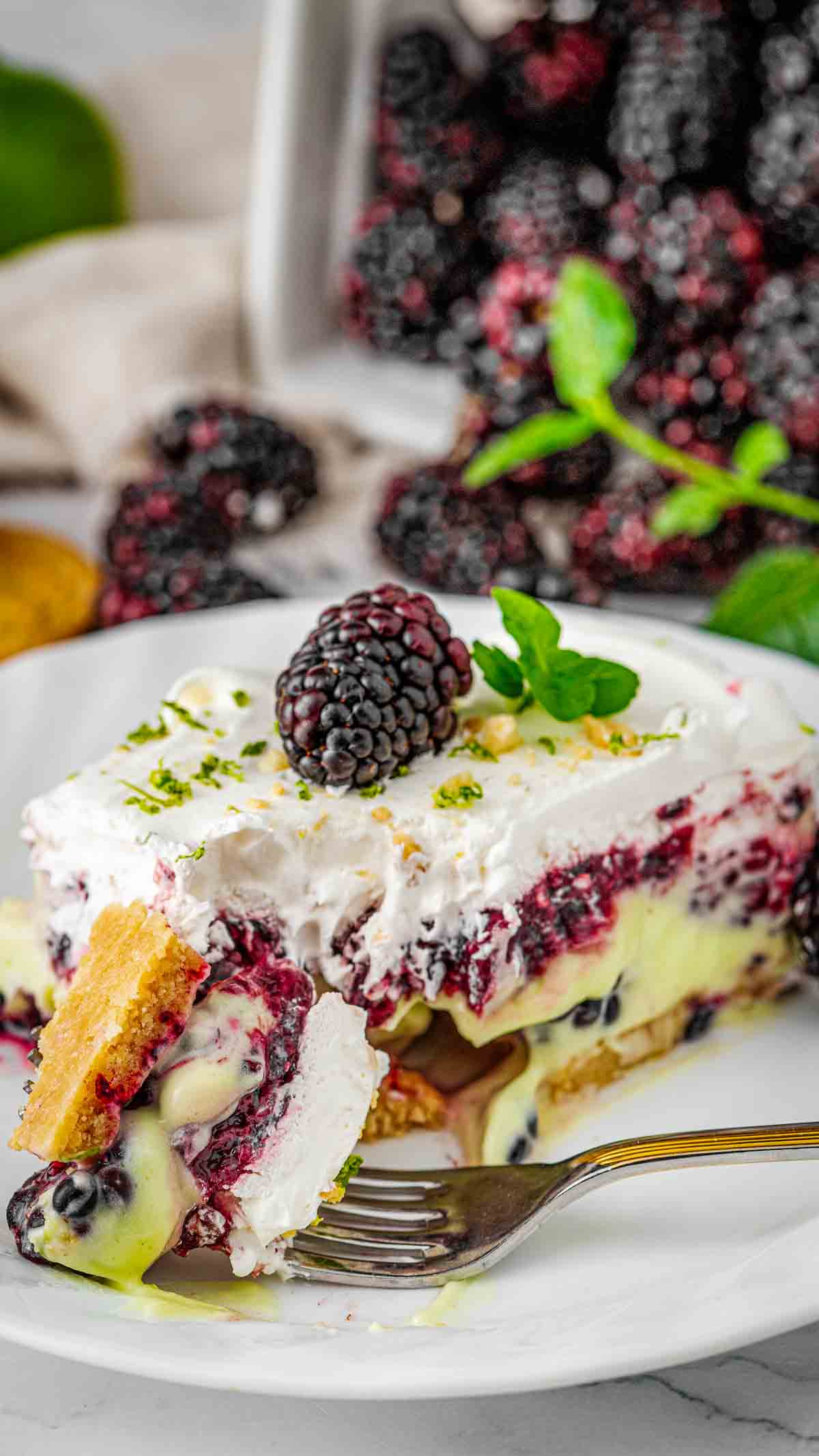 blackberry lime delight made with cream cheese, pudding mix and blackberry pie filling