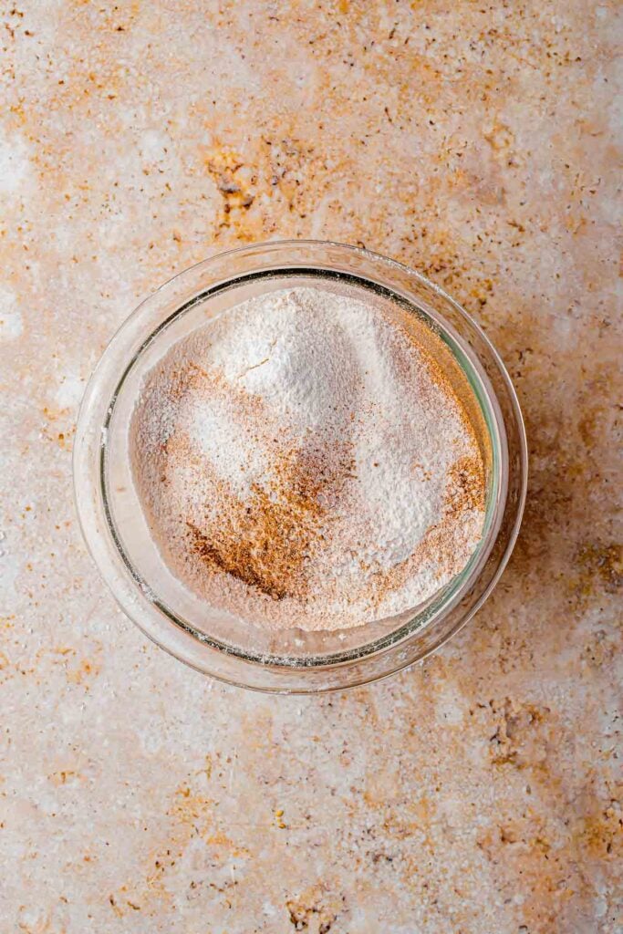 twice sifter flour, nutmeg, baking soda, salt and cinnamon in the bowl