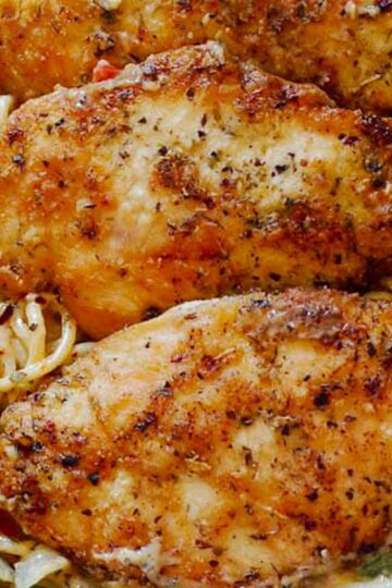 Creamy Italian chicken pasta in white wine parmesan sauce with golden seared chicken"
