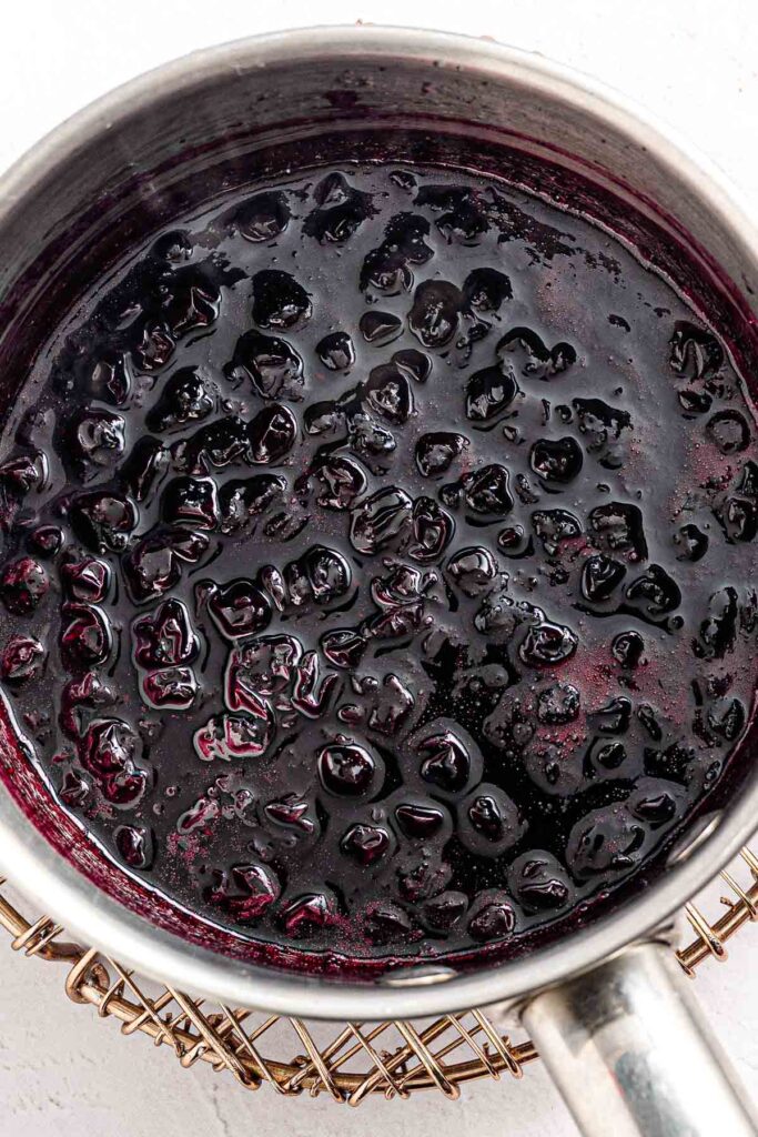 cooked blueberries with sugar inside saucepan for the blueberry swirl