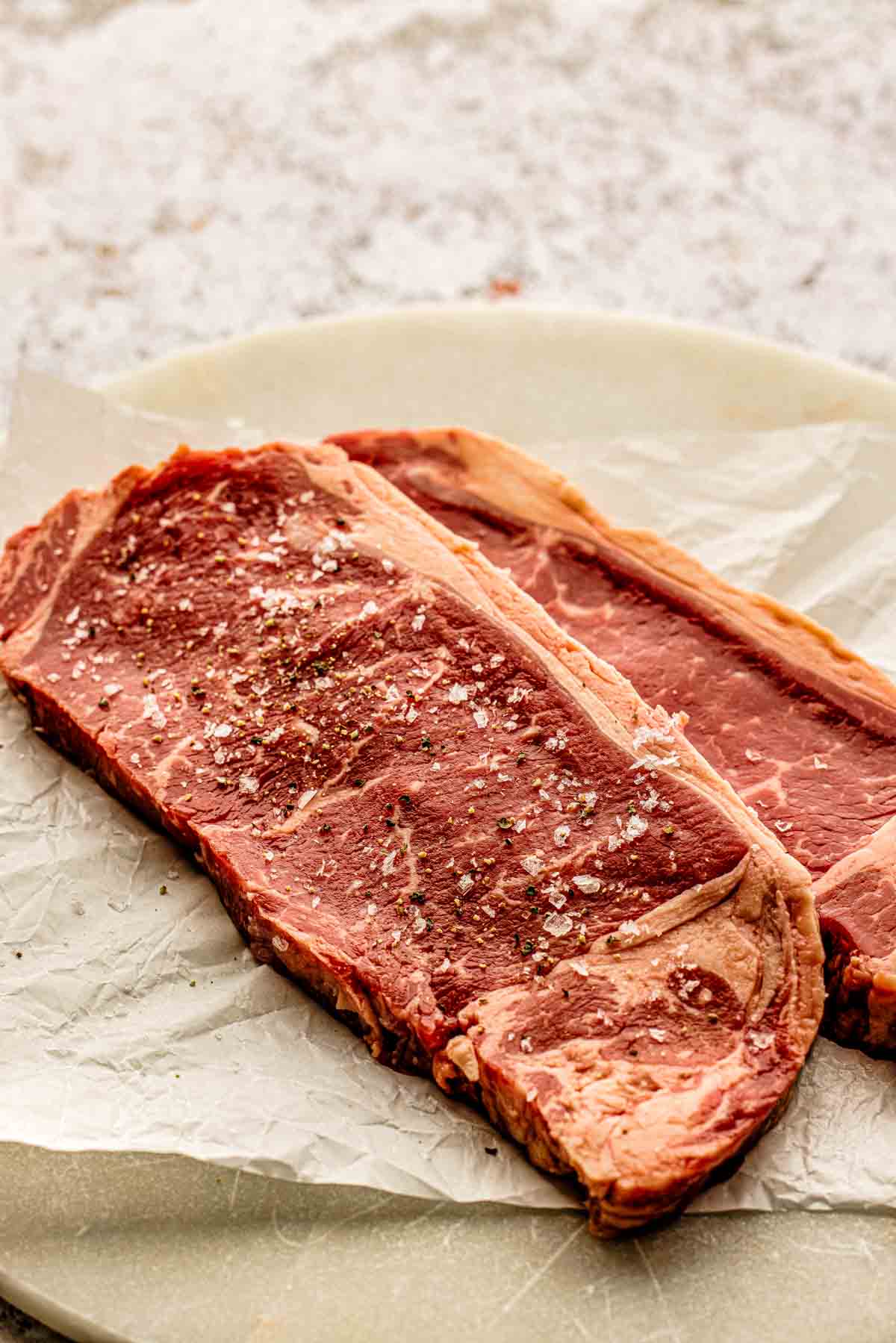steaks brought to room temperature and patted with the paper towels