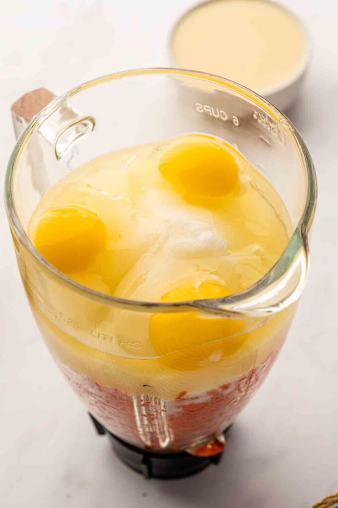 ully mixed brazilian carrot cake batter with eggs inside food processor