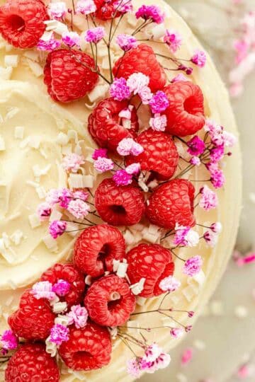fresh raspberries on top of the cake