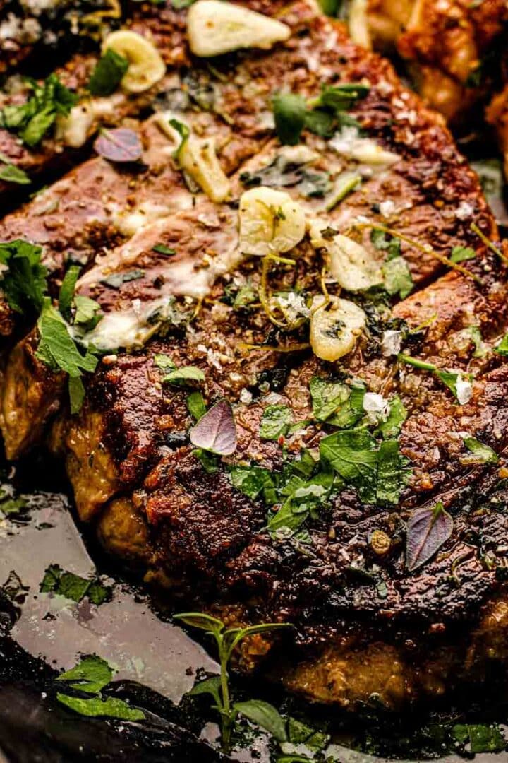 Steak salad with crosshatch grill marks, grilled corn, feta crumbles, and homemade vinaigrette"