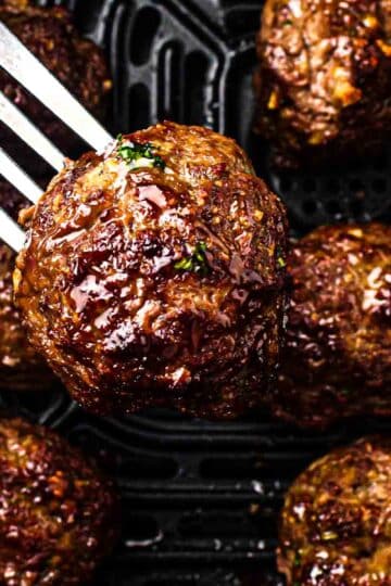 Bright hero shot of air fryer lemon herb meatballs, whipped feta dip, and a small bowl of rice arranged for an easy weeknight dinner.