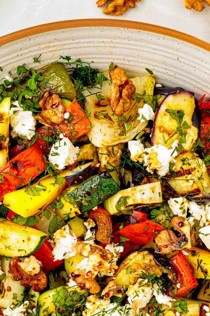 Grilled vegetable salad with eggplant, zucchini, peppers, sweet onion, crumbled feta, toasted walnuts, mint, and dill