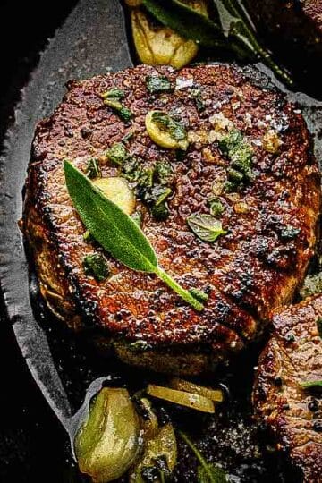 filet mignon steak seared in cast iron pan
