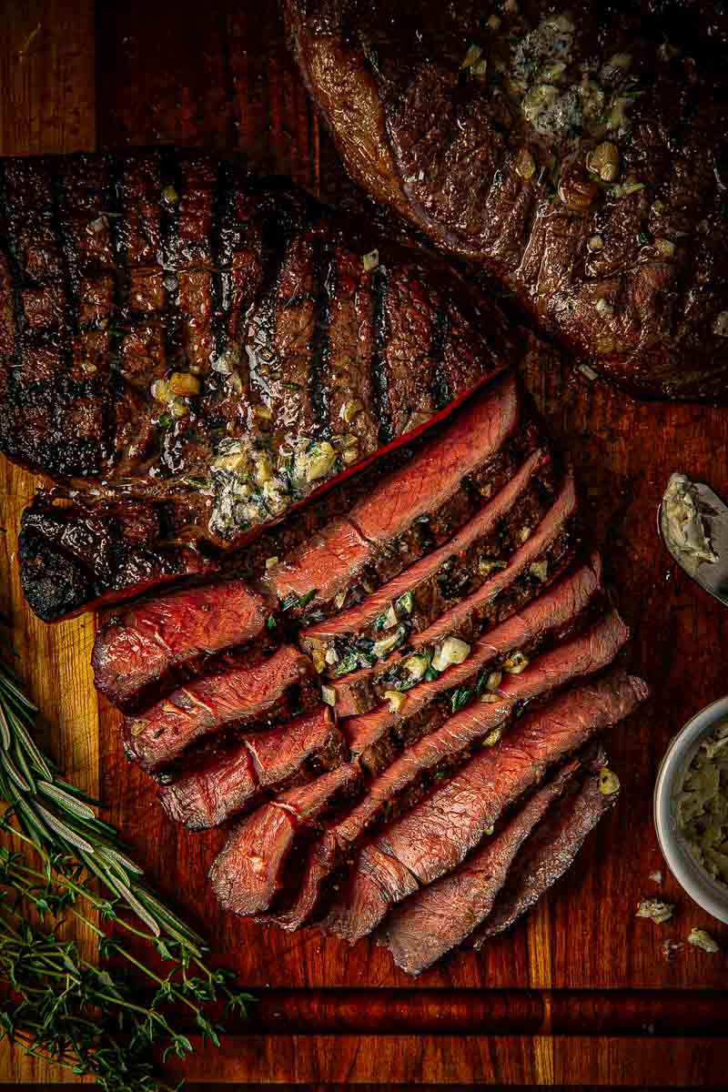 Sliced top sirloin steak reverse seared to medium-rare and served with garlic butter.
