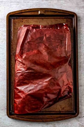brisked tightly wrapped in pink butcher's paper