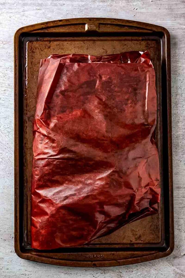 brisked tightly wrapped in pink butcher's paper