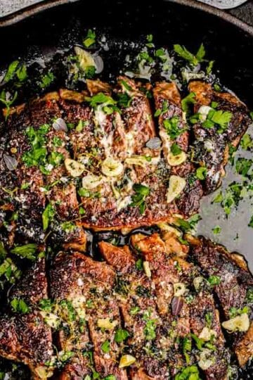 sirloin steak in rustic cast iron skillet