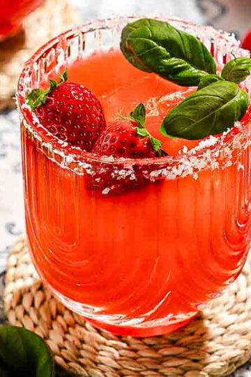 strawberry margarita with fresh strawberries and mint in a glass