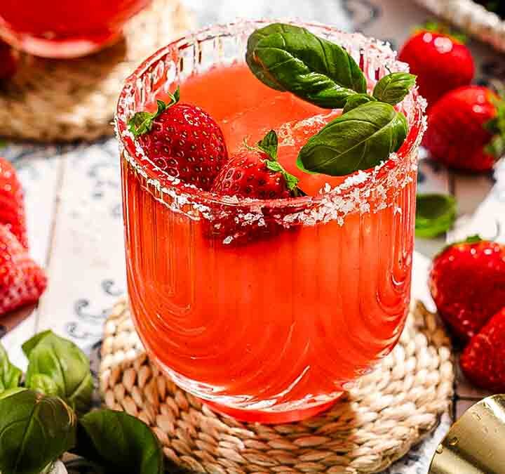 strawberry margarita with fresh strawberries and mint in a glass