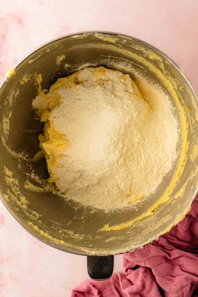 adding flour into wet ingredients