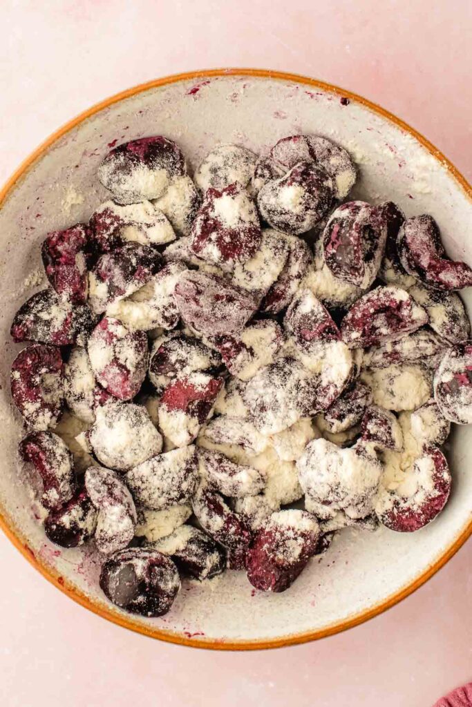 tossed cherries in the extra flour until they're evenly coated