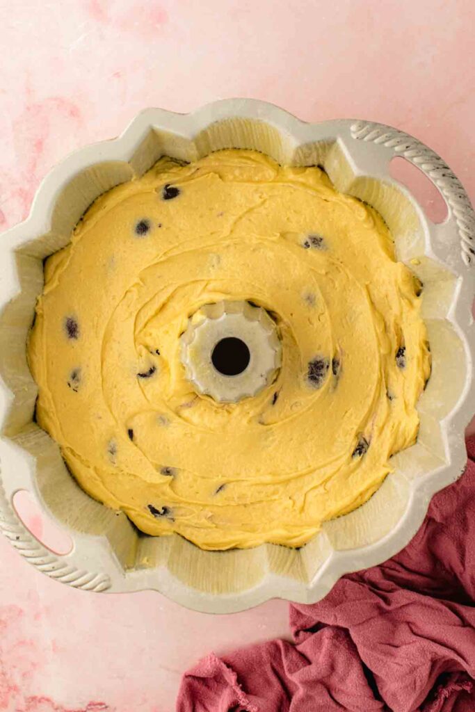 Instant-read thermometer inserted into a fresh cherry bundt cake reading 202 degrees Fahrenheit