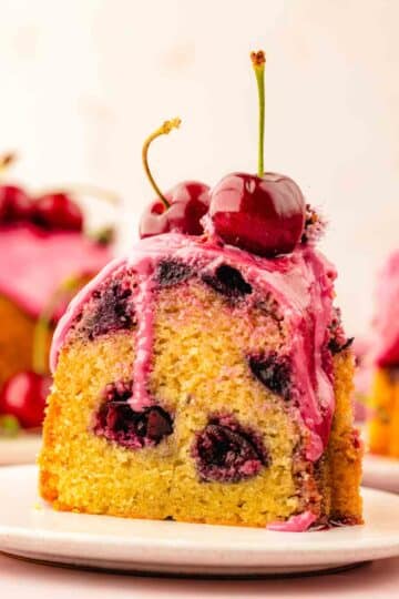 Cherry Bundt Cake with cherries evenly distributed across the cake and not all stuck at the bottom