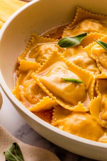 Butternut Squash Ravioli with brown butter in the skillet