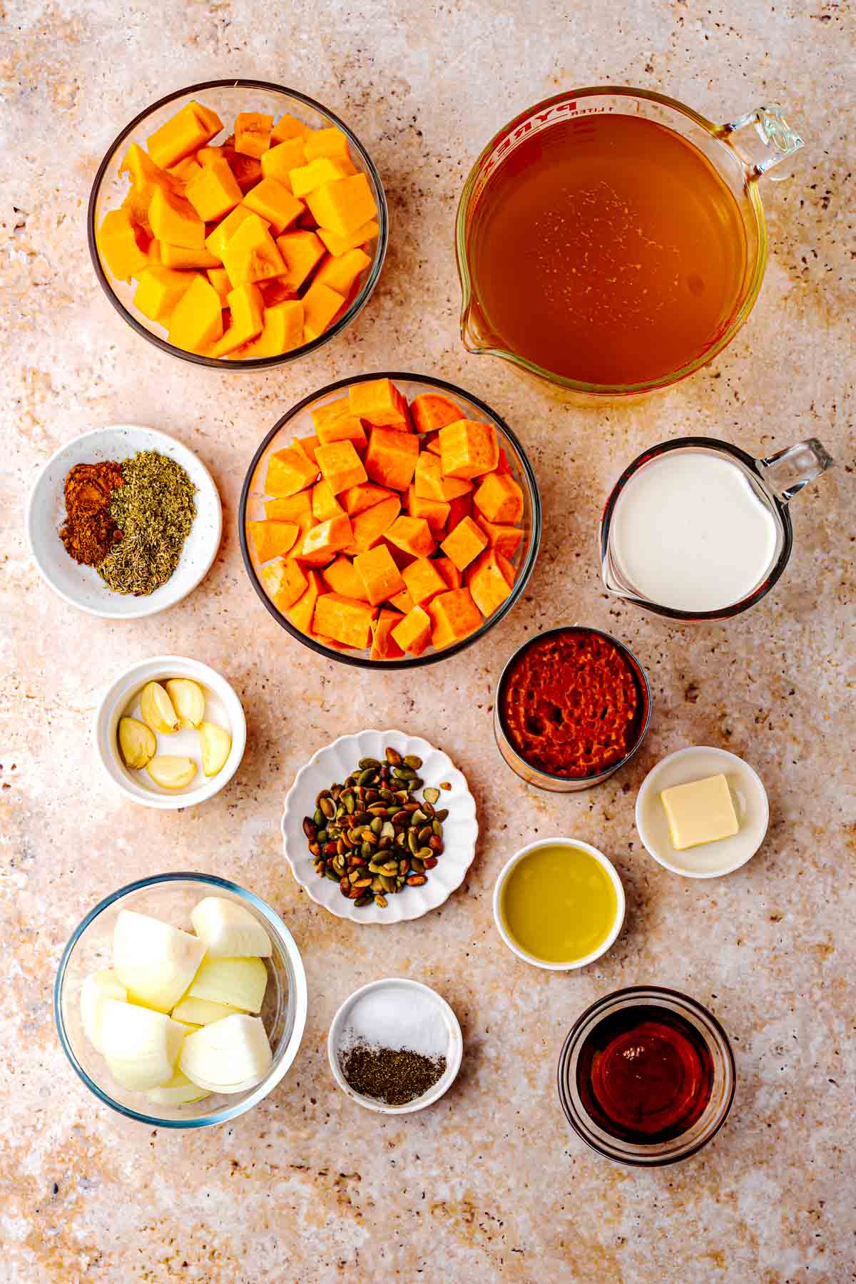 Ingredients for butternut squash pumpkin sweet potato soup with pumpkin seeds and toasted croutons on top