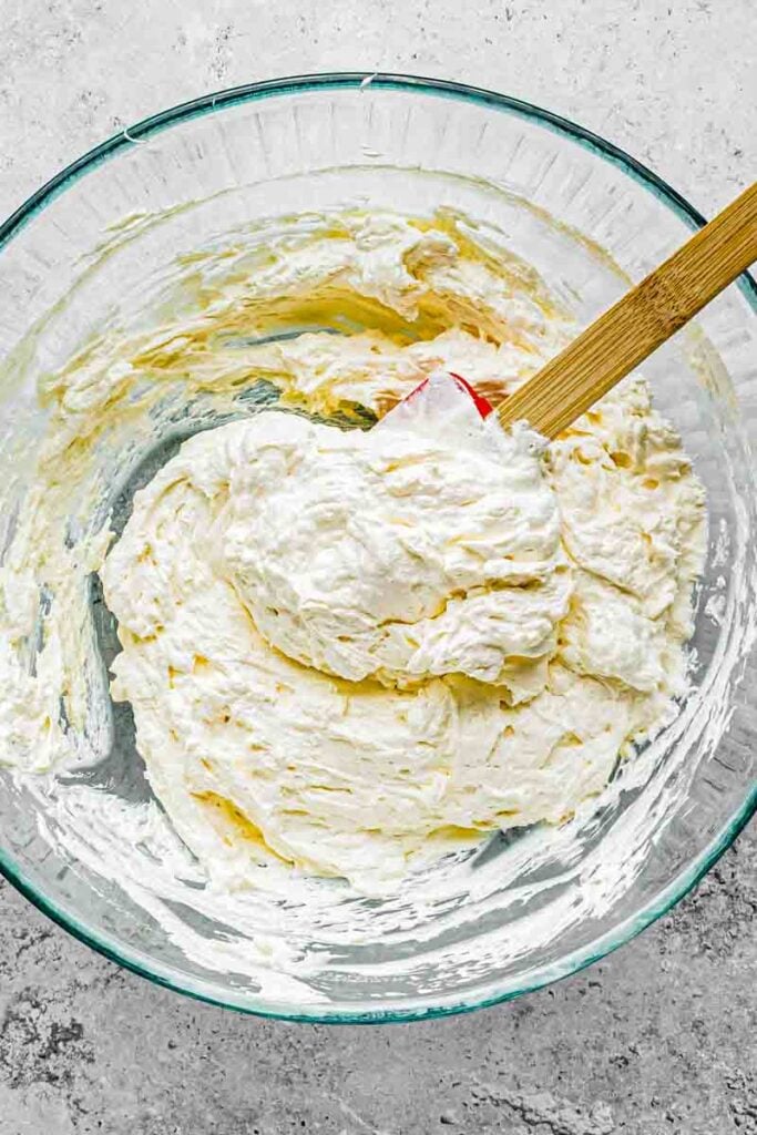 marshmallow fluff, lemon juice, vanilla, almond extract, and salt completely incorporated with whipped cream cheese